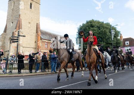 High Street, Maldon, Essex, UK. 1st Jan, 2024. The Puckeridge and Essex Union Hunt (formed by amalgamation of The Essex with Farmers & Union Hunt and the Puckeridge Hunt) paraded their horses and hounds along Maldon High Street for their annual New Year’s Day meeting. Hunt supporters, members of the public and Action Against Foxhunting anti-hunt protesters attended the event. Riders riding past St. Peter's Church Stock Photo