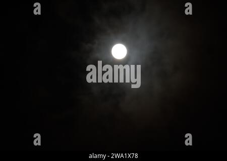 Full moon in a slightly veiled sky Stock Photo