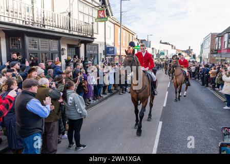 High Street, Maldon, Essex, UK. 1st Jan, 2024. The Puckeridge and Essex Union Hunt (formed by amalgamation of The Essex with Farmers & Union Hunt and the Puckeridge Hunt) paraded their horses and hounds along Maldon High Street for their annual New Year’s Day meeting. Hunt supporters, members of the public and Action Against Foxhunting anti-hunt protesters attended the event, which stopped for refreshments at The Swan pub Stock Photo