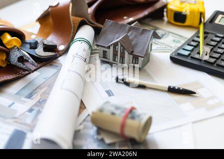 engineering tools on wooden table with drawings apartments top view Stock Photo