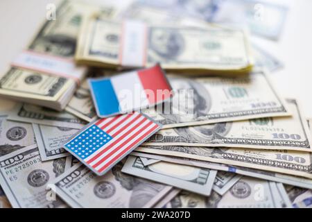 us and french flag on a dollar bill Stock Photo