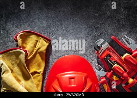 Gloves Helmet And Tools In Belt Stock Photo