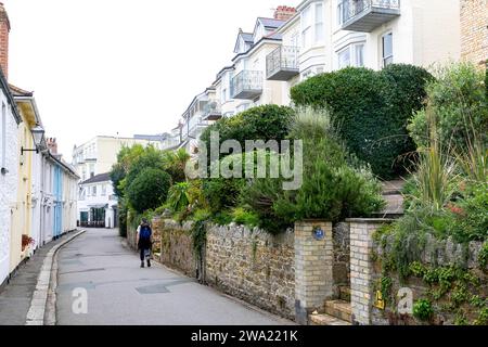 Fowey town centre in Cornwall and one of its narrow streets with homes and cottages, Cornwall,England,UK,2023 Stock Photo