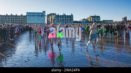 Portobello, Edinburgh, Scotland, UK. 1st January 2024. Loon Dook crowds enjoy the sunshine. Credit: Arch White/alamy live news. Stock Photo