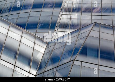 Frank Gehry’s first NYC commission, the billowing-sails-shaped IAC Building, was conceived as metal-clad; the client insisted on white glass instead. Stock Photo