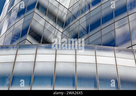 Frank Gehry’s first NYC commission, the billowing-sails-shaped IAC Building, was conceived as metal-clad; the client insisted on white glass instead. Stock Photo