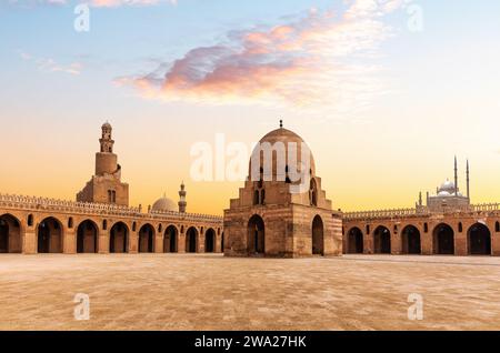 Minaret and ablution fountain of the Ibn Tulun Mosque, sunset view of a famous place of Cairo, Egypt Stock Photo
