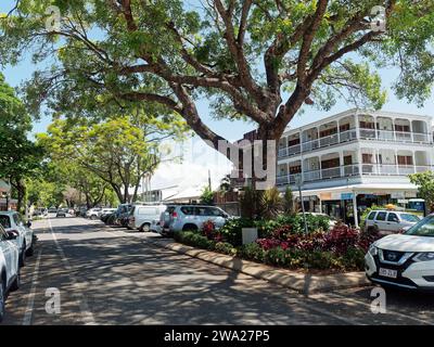 View looking along at the shops, bars and restaurants on Macrossan Street the main shopping street in Port Douglas Queensland Australia Stock Photo