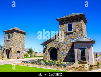 Gate Houses Guarding Entrance To Secure Subdivision Stock Photo