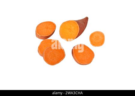 Batata or sweet potato sliced tube with red skin and yellow flesh isolated on white. Vegetable food staple. Stock Photo