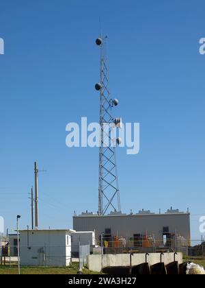 Miami, Florida, United States - 01/01/2024: Tower communications antenna by a pump station in the Everglades. Stock Photo