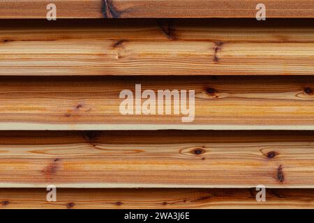Abstract image of Western Red Cedar louvres covering an extraction vent Stock Photo
