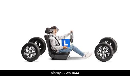 African american young man with learnier plate sitting in a car seat and holding a steering wheel isolated on white background Stock Photo