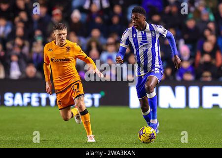 Regan Slater 27 of Hull City chases down Anthony Musaba 45 of Sheffield Wednesday during the Sky Bet Championship match Sheffield Wednesday vs Hull City at Hillsborough, Sheffield, United Kingdom, 1st January 2024  (Photo by Ryan Crockett/News Images) Stock Photo