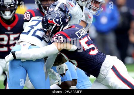 Houston, Texas, USA. 31st Dec, 2023. Houston Texans linebacker Blake Cashman (53) tackles Tennessee Titans running back Tyjae Spears (32) during the game between the Houston Texans and the Tennessee Titans at NRG Stadium in Houston, TX on December 31, 2023. (Credit Image: © Erik Williams/ZUMA Press Wire) EDITORIAL USAGE ONLY! Not for Commercial USAGE! Stock Photo