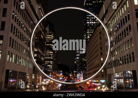 Gigantic Ring at night at Esplanade Place Ville Marie in downtown Montreal, Quebec, Canada Stock Photo
