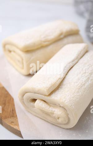 Raw puff pastry dough on white tiled table, closeup Stock Photo - Alamy