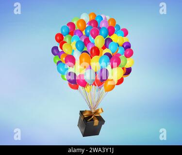 Many balloons tied to gift box on bright background Stock Photo