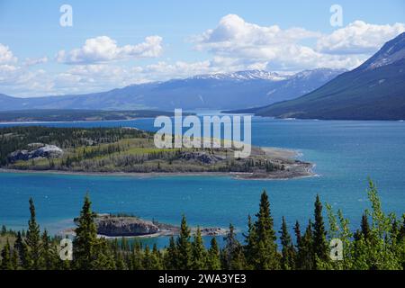 Emerald Lake, Yukon also known as Rainbow Lake. Emerald Green water is a GEM near Mount Gilliam and Surprise Mountain. Just outside Alaska Stock Photo