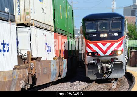 Wheaton, Illinois, USA. A Metra commuter train on a curve as it arrives at a local suburban community depot. Stock Photo