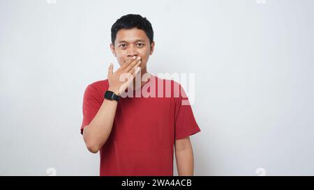Asian man is using sign language with hand against white background. learn sign language by hand. ASL American Sign Language Stock Photo