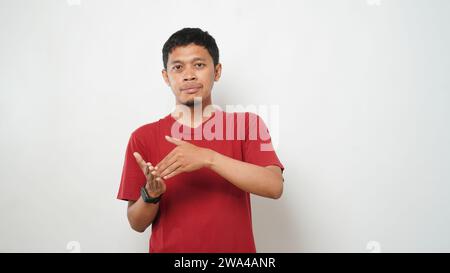 Asian man is using sign language with hand against white background. learn sign language by hand. ASL American Sign Language Stock Photo