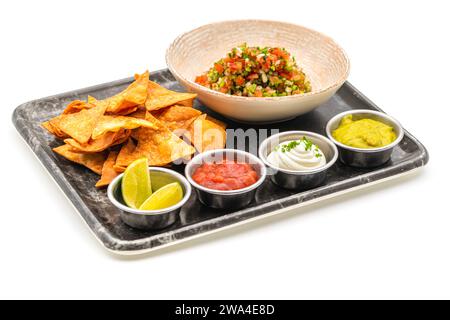Pico de gallo from Mexican cuisine with dipping sauces on white background Stock Photo