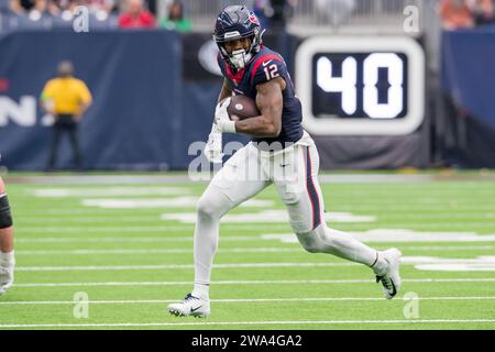 December 31, 2023: Houston Texans wide receiver Nico Collins (12) runs after making a catch during a game between the Tennessee Titans and the Houston Texans in Houston, TX. ..Trask Smith/CSM (Credit Image: © Trask Smith/Cal Sport Media) Stock Photo