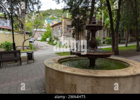 Pyatigorsk, Russia - May 12, 2023: Street view of old Pyatigorsk old town with round fountain on an empty boulevard Stock Photo