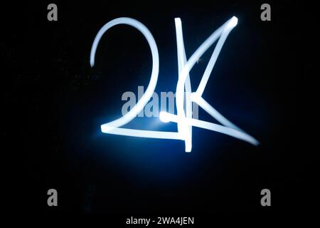 2K word sparkler on black background. Stock Photo