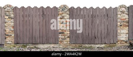 Old fence made of curved boards and stones isolated  on white Stock Photo