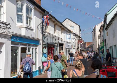 People shopping in the streets of Sidmouth town centre, Devon,England on a hot sunny September 2023 day Stock Photo