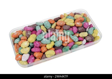 Candies from nuts and sugar glaze "Sea stones" in a box. Isolated on white Stock Photo