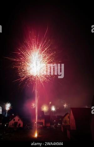 Silvester fireworks in a residential area on New Year's Eve Stock Photo