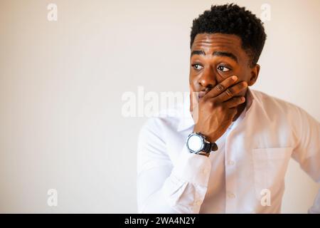 Portrait of young businessman who is shocked. Stock Photo