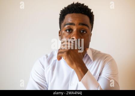 Portrait of young businessman who is tired and disappointed. Stock Photo