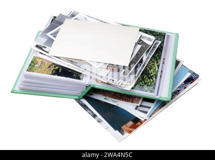 old family photo albums and photos heap isolated on white Stock Photo