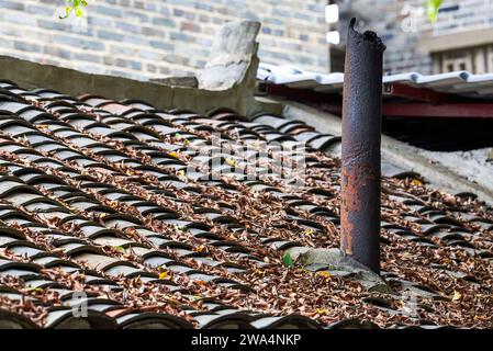 Close-up of chimney on tiled roof of rural house in China Stock Photo