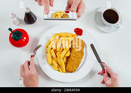 Photographing a fish and chips dinner Stock Photo