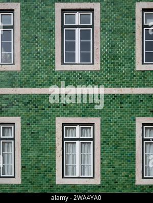 building facade is decorated with azulejos - Painted ceramic tiles, Bairro Alto District, Lisbon, Portugal Stock Photo