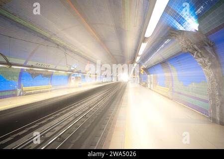 Parque subway station in Lisbon, on the railway platform with light entering at the end of the tunnel Stock Photo