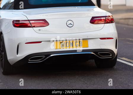 Mercedes Benz E car with special number plate B10W GB, B10 WGB blow job, crude term, driving in Maldon, UK. Cherished, personalised registration plate Stock Photo