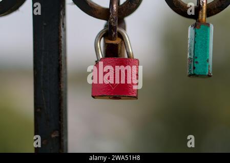 Lovelock red lock with engraved heart closeup horizontal shot blurred background Stock Photo