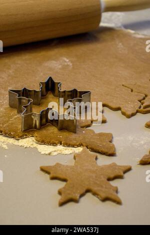 Metal mold for cutting out cookies on rolled out dough Stock Photo