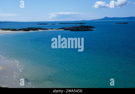 The Isle of Eigg viewed from the beach at Arisaig Lochaber Scotland Stock Photo