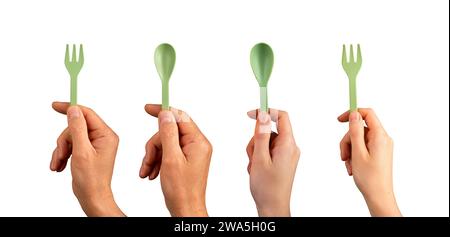 Hands holding eco reusable plastic spoon and fork set isolated on white Stock Photo
