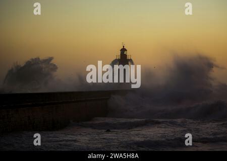 Portuguese Lighthouse with stormy Atlantic wave. Stock Photo