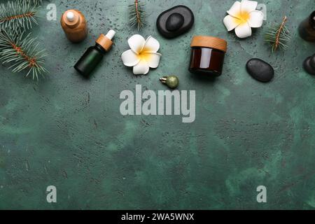 Spa composition with fir branches on green background Stock Photo