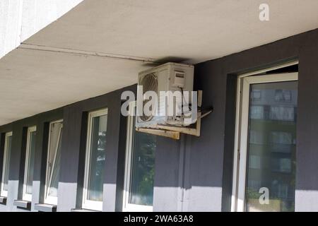 Air conditioners on the wall of a tall building Stock Photo