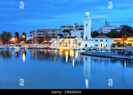 Rimini Lighthouse towering over the harbor at night in Rimini, Emilia-Romagna province of Italy. The lighthouse dates from 1745, although it was rebui Stock Photo